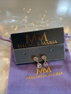 Melinda Maria Gold Teardrop Crystal Drop Earrings on Lavender Pouch